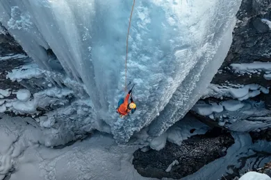 woman-climbing-frozen-waterfall-746-419.jpg